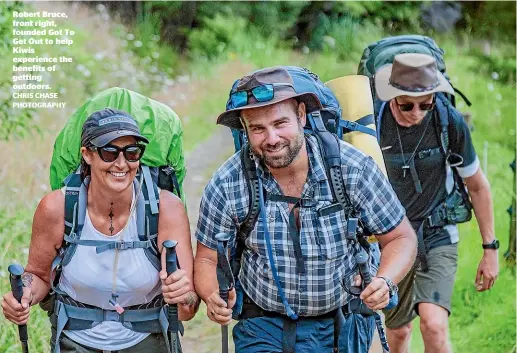  ?? CHRIS CHASE PHOTOGRAPH­Y ?? Robert Bruce, front right, founded Got To Get Out to help Kiwis experience the benefits of getting outdoors.
Aaron, left, is keen to take on more challenges after completing a 10-day hike.