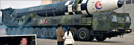  ?? ?? SPECIAL TREAT: Kim Jong Un shows off the 85ft Hwasong-17 interconti­nental ballistic missile to his daughter
