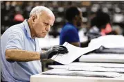  ?? SCOTT MCINTYRE / THE NEW YORK TIMES ?? A voting technician sorts ballots Saturday at the Palm Beach County Supervisor of Elections facility in Riviera Beach, Fla.