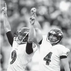 ?? DON WRIGHT/AP ?? Ravens kicker Justin Tucker, left, and holder Sam Koch celebrate after Tucker made an overtime field goal to defeat the Steelers last season.