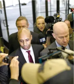  ?? — AFP photo ?? Mohamed Noor (left) arrives for the beginning of his trial in Minneapoli­s, Minnesota.