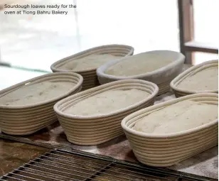  ?? ?? Sourdough loaves ready for the oven at Tiong Bahru Bakery