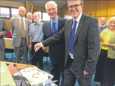  ??  ?? Cutting the birthday cake is John Brown, Hi Kent’s founder, left, and Clive Reddihough, chairman of trustees