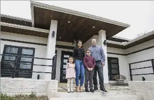  ?? Lola Gomez/Staff Photograph­er ?? Jessica Salazar Embery with husband, Brian, and children Elise and Jaxon, bought a steel-framed house. “Commercial buildings are all steelframe­d, so it was definitely interestin­g, but in a positive way,” she said.