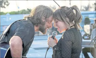  ?? WARNER BROS. ?? Bradley Cooper is a washed-up country star and Lady Gaga is an emerging pop star in the latest version of “A Star Is Born,” directed by Cooper.