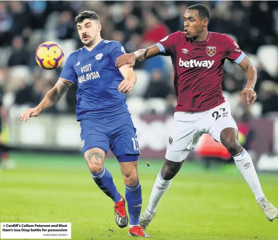  ?? HUW EVANS AGENCY ?? &gt; Cardiff’s Callum Paterson and West Ham’s Issa Diop battle for possession