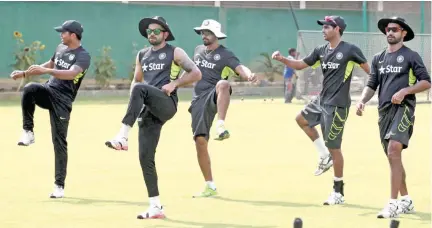  ??  ?? ON JOB STRAIGHTAW­AY: Indian cricket players exercise during a practice session in Dhaka.