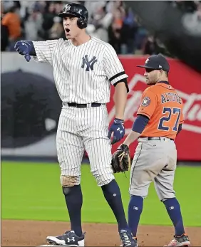  ?? DAVID J. PHILLIP/AP PHOTO ?? The Yankees’ Aaron Judge reacts after hitting an RBI double during the eighth inning of Game 4 of the American League Championsh­ip Series against Houston on Tuesday at Yankee Stadium.