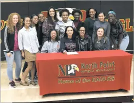  ??  ?? SUBMITTED PHOTO North Point High School senior Aimee Latour signed her national letter of intent Feb. 8 to play soccer at Howard University in Washington, D.C., in the North Point gymnasium. Latour, pictured in the middle, is is surrounded by many of...