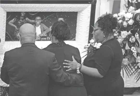  ??  ?? Family and friends attend Saturday’s funeral for Brandon Gales, who died on July 30 after being shot at the Walmart in Southaven, Mississipp­i.