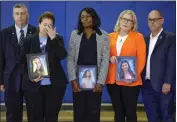  ?? AL DIAZ — MIAMI HERALD VIA THE ASSOCIATED PRESS ?? The family of students who were killed during the shooting at Marjory Stoneman Douglas High School six years earlier react as Vice President Kamala Harris speaks during a visit to the school in Parkland, Fla., on Saturday.