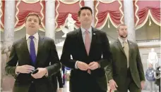  ?? — Reuters ?? US House Speaker Paul Ryan (C) walks to the House Chamber to vote on Obamacare repeal, on Capitol Hill in Washington, on Friday.