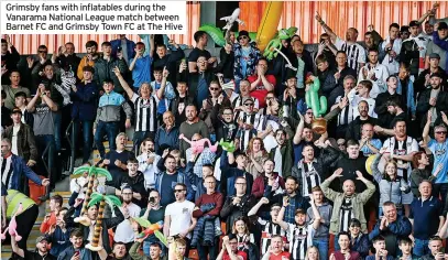  ?? ?? Grimsby fans with inflatable­s during the Vanarama National League match between Barnet FC and Grimsby Town FC at The Hive