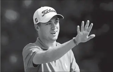  ?? MICHAEL DWYER/AP PHOTO ?? Justin Thomas reacts to his tee shot on the fourth hole during the final round of the Dell Technologi­es Championsh­ip golf tournament on Monday at TPC Boston in Norton, Mass. Thomas shot a 5-under 66 to win his fifth tournament of the year and move a...