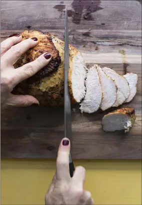  ?? SARAH CROWDER ?? This 2017photo shows a recipe for roasted turkey breast, perfect for serving a smaller group on Thanksgivi­ng.