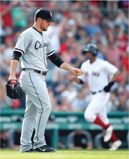  ?? MICHAEL DWYER/ AP ?? Xander Bogaerts rounds third base behind Carlos Rodon on J. D. Martinez’s two- run homer in the fifth inning Saturday.