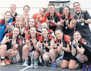  ??  ?? Dundee Wanderers players with their gold medals after they topped the EuroHockey Indoor Club Challenge in Portugal.