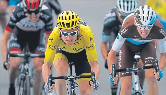  ?? Pictures: AP. ?? Out in front: Geraint Thomas gets ahead of the pack on yesterday’s final mountain test in the Tour de France.