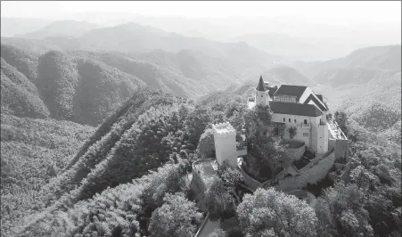  ?? PROVIDED TO CHINA DAILY ?? Naked Castle, a resort developed by the Naked Group, sits atop a hill in the Mogan Mountain area of Deqing, Zhejiang province.