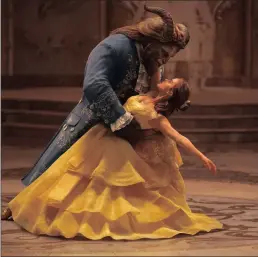  ??  ?? Emma Watson stars as Belle and Dan Stevens as the Beast in Beauty and the Beast.