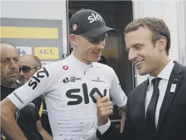  ?? PICTURE: CHRISTOPHE ENA/AP ?? 0 Chris Froome talks to French president Emmanuel Macron after his win.