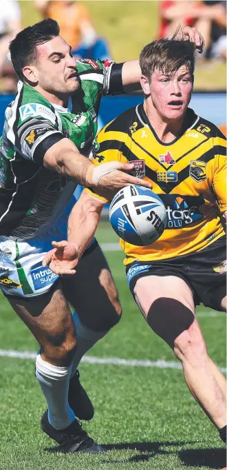  ?? Picture: WARREN LYNAM ?? CLOSING IN: Townsville Blackhawk Kieran Quabba lays a tackle on Falcons hooker Harry Grant in his side’s Queensland Cup finals win at Sunshine Coast Stadium yesterday.