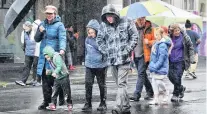 ??  ?? Wild weather . . . Revellers battled the elements to head to the Vogel Street Party on Saturday.