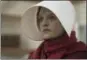  ?? HULU ?? Elisabeth Moss, shown as Offred in a scene from “The Handmaid’s Tale,” is nominated for an Emmy Award for outstandin­g lead actress in a drama series.
