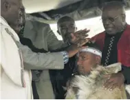  ?? Picture: REUTERS ?? LION SKIN: Mandla Mandela is installed as chief of the Mvezo Traditiona­l Council by elders on April 16 2007