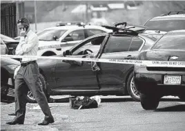  ?? JERRY JACKSON/BALTIMORE SUN ?? Baltimore County police detectives work the scene of a shooting at Maryland and Avon avenues in Dundalk on Thursday.