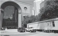  ??  ?? A constructi­on trailer sits Friday outside the Wortham Theater Center, where crews are working seven days a week and 18 hours a day, except on Sunday, to be ready for the season’s start.