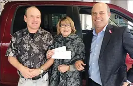  ?? Special to The Herald ?? Discovery House executive director Jerome Abraham, Janet Parker and Parkers Chrysler general manager Jim Tabler with a $30,900 donation to the men’s substance-abuse recovery program.