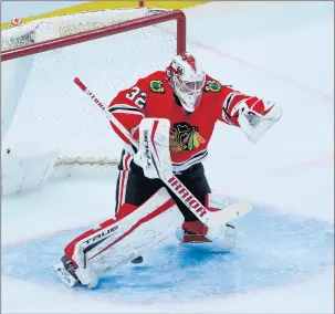  ?? CHRIS SWEDA/CHICAGO TRIBUNE ?? Chicago Blackhawks goaltender Kevin Lankinen (32) is unable to stop the puck as Columbus Blue Jackets right wing Cam Atkinson scores a goal. As of now, Lankinen ranks 6th in goals saved among average.