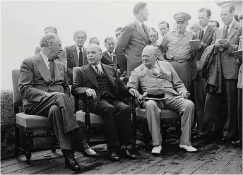  ?? Library and Archives Canada photo ?? Mackenzie King hosts Franklin Roosevelt and Winston Churchill at the Quebec Conference in August 1943, which approved the Allies’ plan to liberate Europe in 1944. King was Canada’s longest serving prime minister—22 years in office, including the...