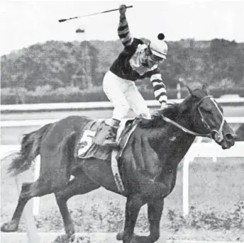  ?? ASSOCIATED PRESS ?? Seattle Slew, ridden by Jean Cruguet, won the 1977 Belmont to complete his Triple Crown performanc­e.