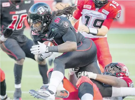  ?? WAYNE CUDDINGTON / OTTAWA CITIZEN ?? Redblacks’ Aston Whiteside scrambles with a fumbled ball Friday night at TD Place.