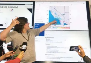  ?? The Associated Press ?? 6.4 MAGNITUDE: Seismologi­st Lucy Jones talks Thursday during a news conference at the Caltech Seismologi­cal Laboratory in Pasadena, Calif. A strong earthquake rattled a large swath of Southern California and parts of Nevada on Thursday morning, making hanging lamps sway and photo frames on walls shake. There were no immediate reports of damage or injuries but a swarm of aftershock­s were reported.