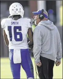  ?? TODD BENNETT / GETTY IMAGES ?? After a 4-39 stretch, coach Trent Miles (with corner Jerome Smith) led Georgia State to a bowl game last season.