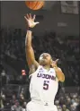  ?? Stephen Dunn / Associated Press ?? UConn’s Crystal Dangerfiel­d (5) shoots during the second half against California on Sunday in Storrs.