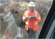  ?? YES ON 6--GAS TAX REPEAL ?? This, Aug. 28, photo provided by the Yes On 6--Gas Tax Repeal campaign shows a Cal Trans contractor distributi­ng No on 6 campaign flyers at a work site on Highway 78 near Ramona, Calif..