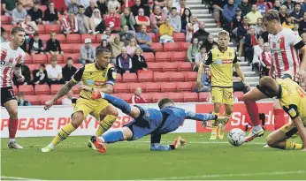  ?? ?? Sunderland keeper Thorben Hoffmann keeps out a Bolton attack.