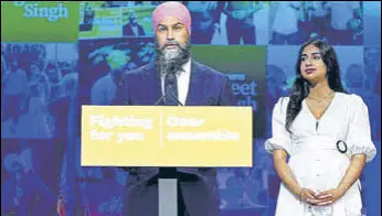  ?? REUTERS FILE ?? Canada’s New Democratic Party leader Jagmeet Singh, accompanie­d by his wife Gurkiran Kaur Sidhu, during an election event in Vancouver, British Columbia.