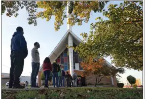  ?? (AP File/LM Otero) ?? Voters line up November 3 outside Vickery Baptist Church to cast their ballots in Dallas.