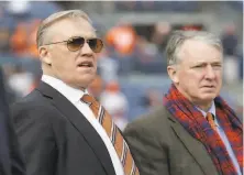  ?? Jack Dempsey / Associated Press 2017 ?? Denver Broncos general manager John Elway ( left) and President Joe Ellis have tested positive for the coronaviru­s.