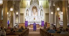  ?? Emily Matthews/Post-Gazette ?? The Rev. Michael Stumpf addresses the congregati­on during Mass at St. Mary of the Mount Church on March 15 on Mount Washington.