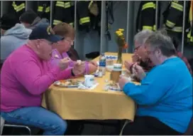  ?? BY GLENN GRIFFITH — THE SARATOGIAN ?? Gary and Jacqui Goodmanson, left, and Bob and Shirley Campbell, right, enjoyed a Thanksgivi­ng dinner at the Ballston Spa Union Fire Company No.2 firehouse Thursday