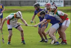  ??  ?? Kiltegan’s Eoin O’Neill gets a grip of Padraig Doran’s hurl.