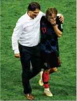  ?? ALEXANDER HASSENSTEI­N / GETTY IMAGES ?? Croatia coach Zlatko Dalic and star midfielder Luka Modric celebrate Wednesday’s 2-1 semifinal victory over England in Moscow. Not since Uruguay’s win in 1950 has a country of so few people (4.3 million) reached a World Cup final.