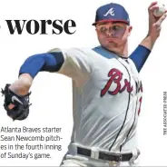  ??  ?? Atlanta Braves starter Sean Newcomb pitches in the fourth inning of Sunday’s game.