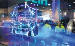  ?? JOHN LOCHER/ASSOCIATED PRESS ?? A translucen­t screen shows smart car technology at an Intel booth during a CES Internatio­nal show in Las Vegas, Nev., in 2017.